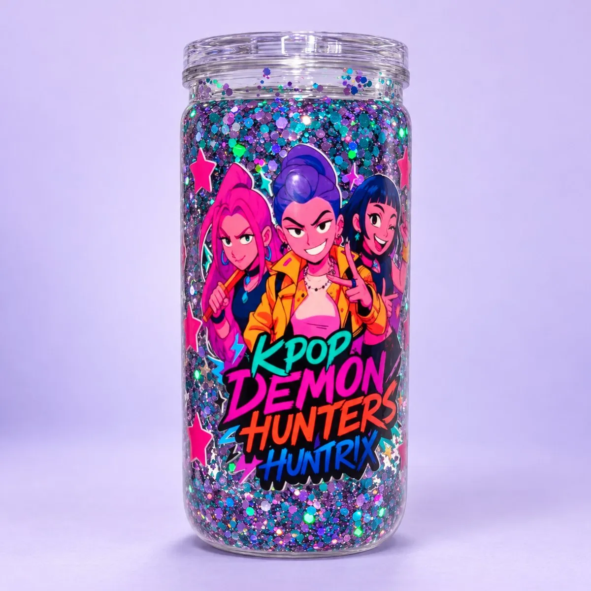 Idol Hunters Glitter Snow Globe Cup on a pale lavender backdrop — clear can-shaped snow globe cup with a double wall packed with purple, teal and silver glitter, printed with three animated pop-idol girls and bold pink lettering, with its clear lid
