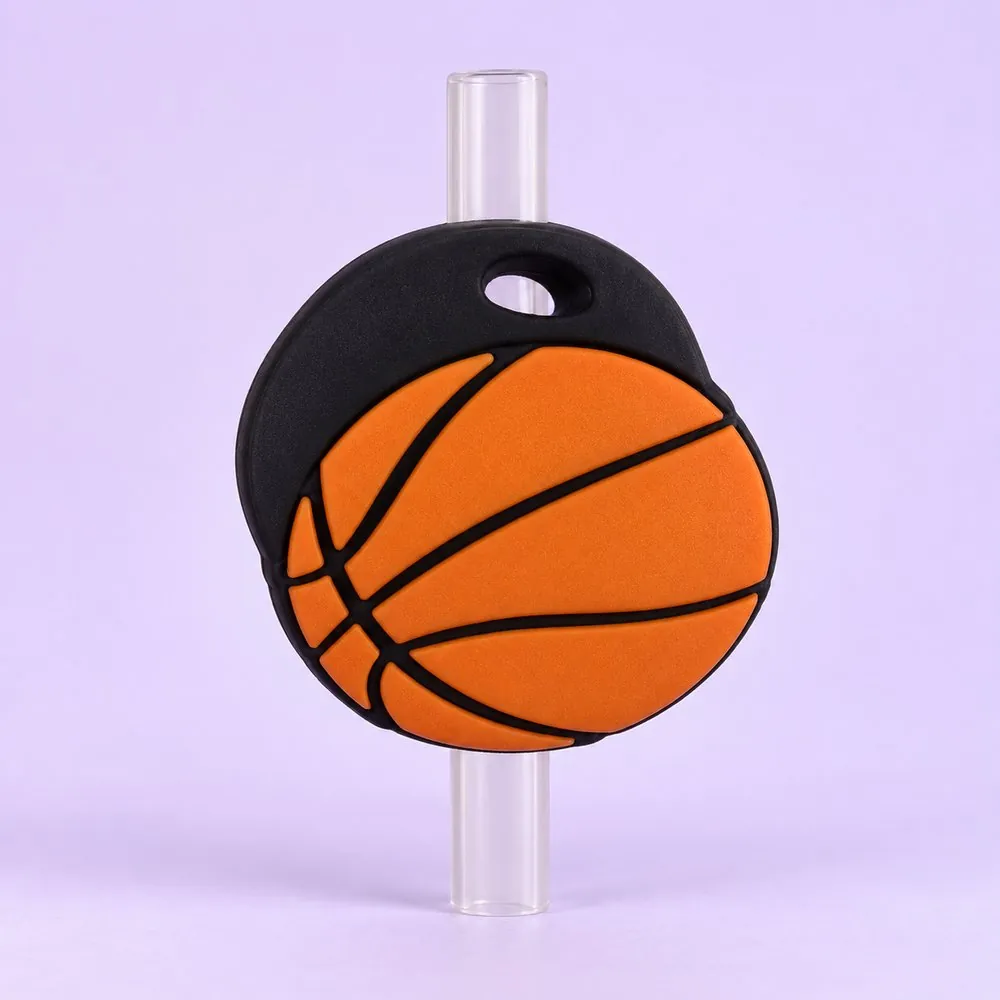 Basketball Topper on a clear straw, pale lavender backdrop — shaped like an orange basketball