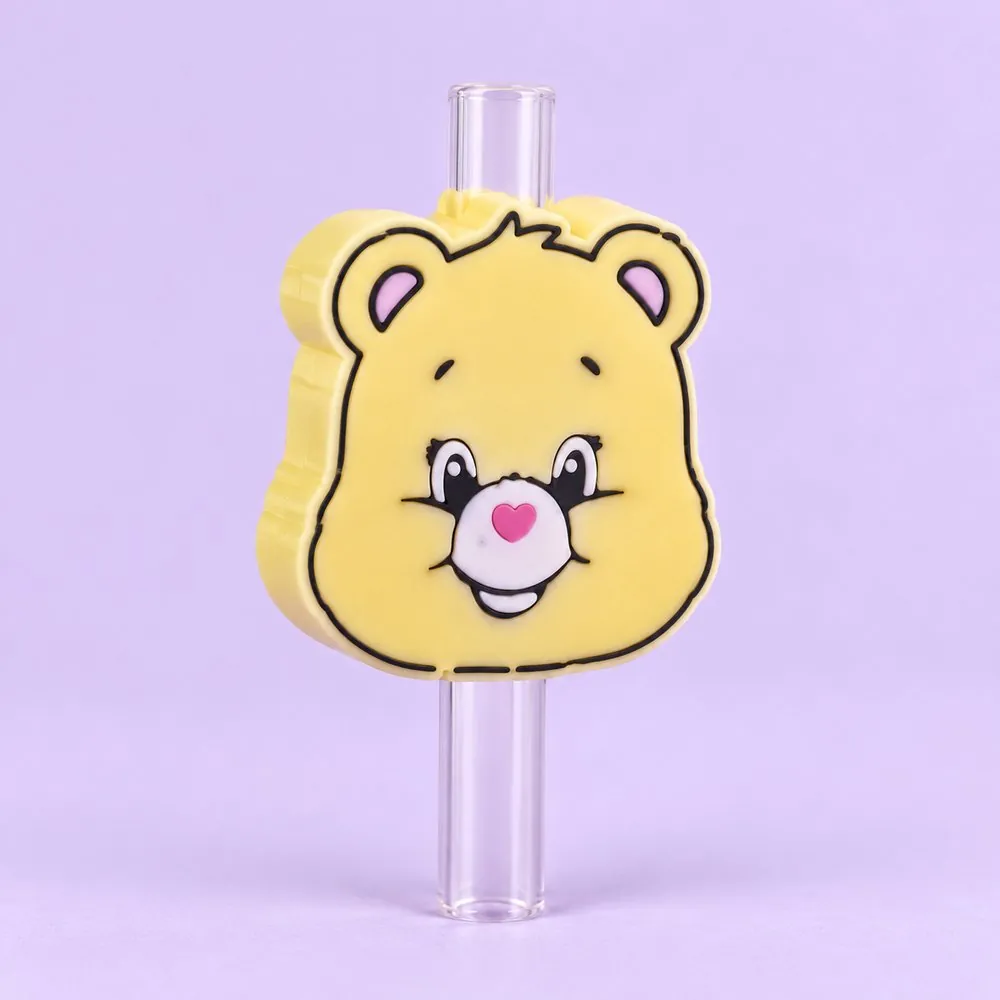 Buttercream Bear Topper on a clear straw, pale lavender backdrop — shaped like a pale butter-yellow cartoon bear face with a pink heart nose