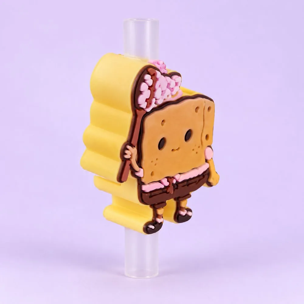 Little Star Topper on a clear straw, pale lavender backdrop — shaped like a small cartoon girl in a pink outfit holding a tall yellow shape