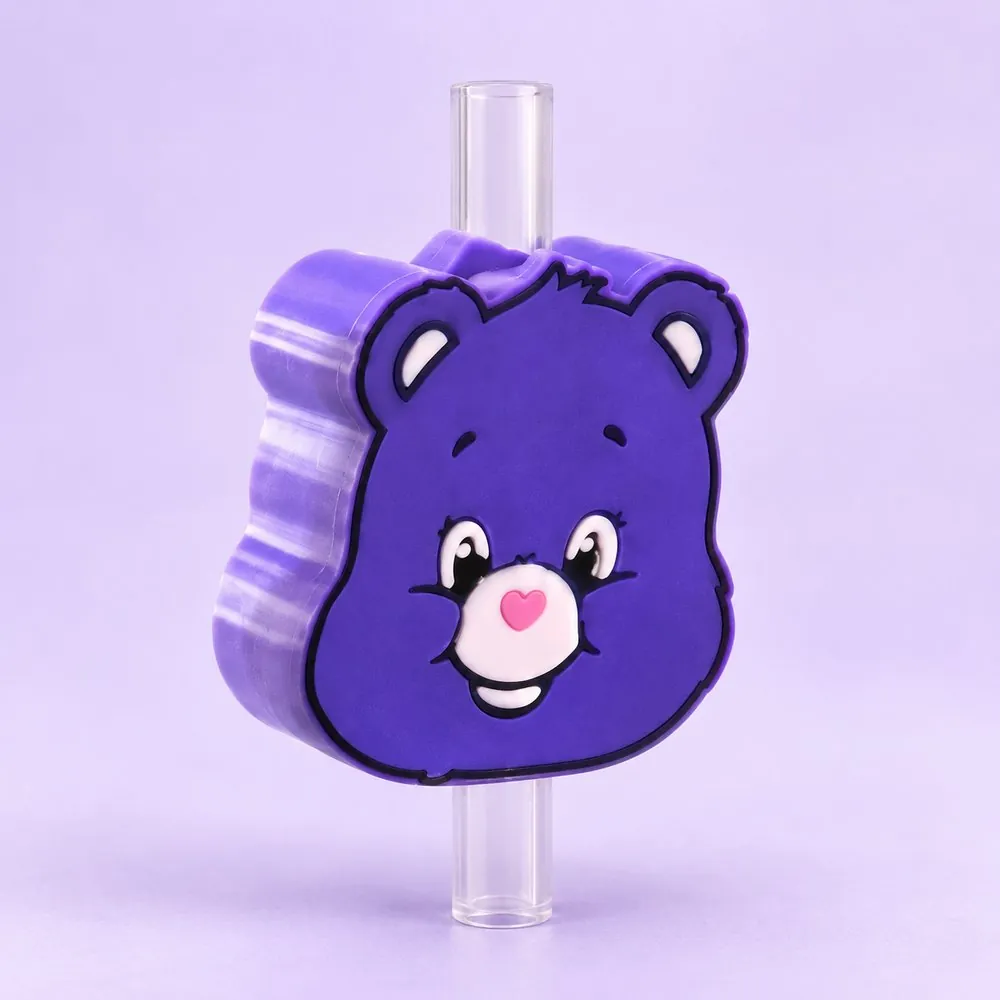 Purple Wish Bear Topper on a clear straw, pale lavender backdrop — shaped like a purple cartoon bear face with a pink nose