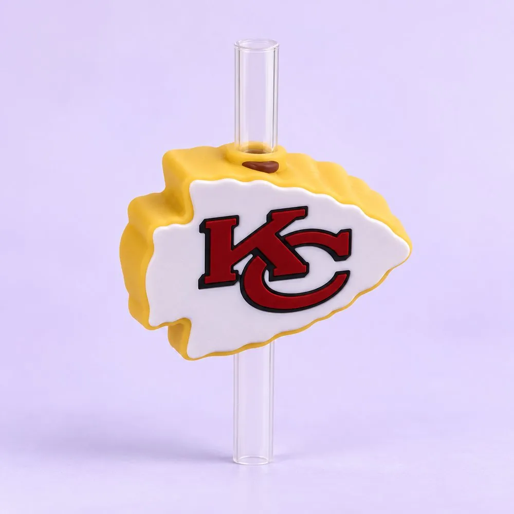 Red Arrowhead Football Topper on a clear straw, pale lavender backdrop — shaped like a red arrowhead football team emblem on gold