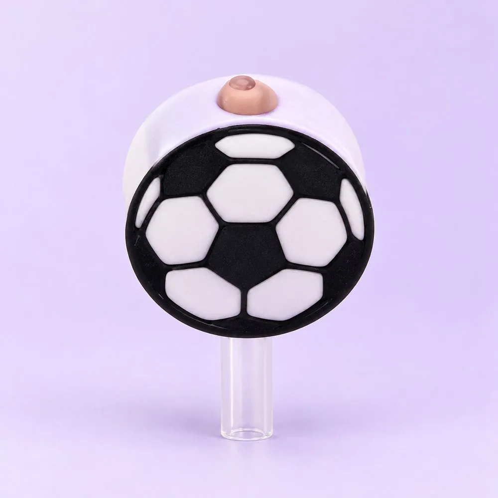 Soccer Ball Topper on a clear straw, pale lavender backdrop — shaped like a black and white soccer ball