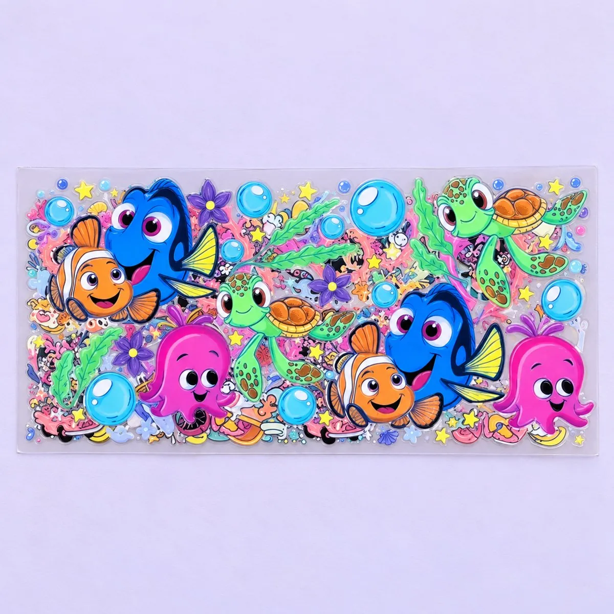 Reef Fish Friends cup wrap laid flat — blue tang, orange clownfish and pink octopus reef characters with bubbles